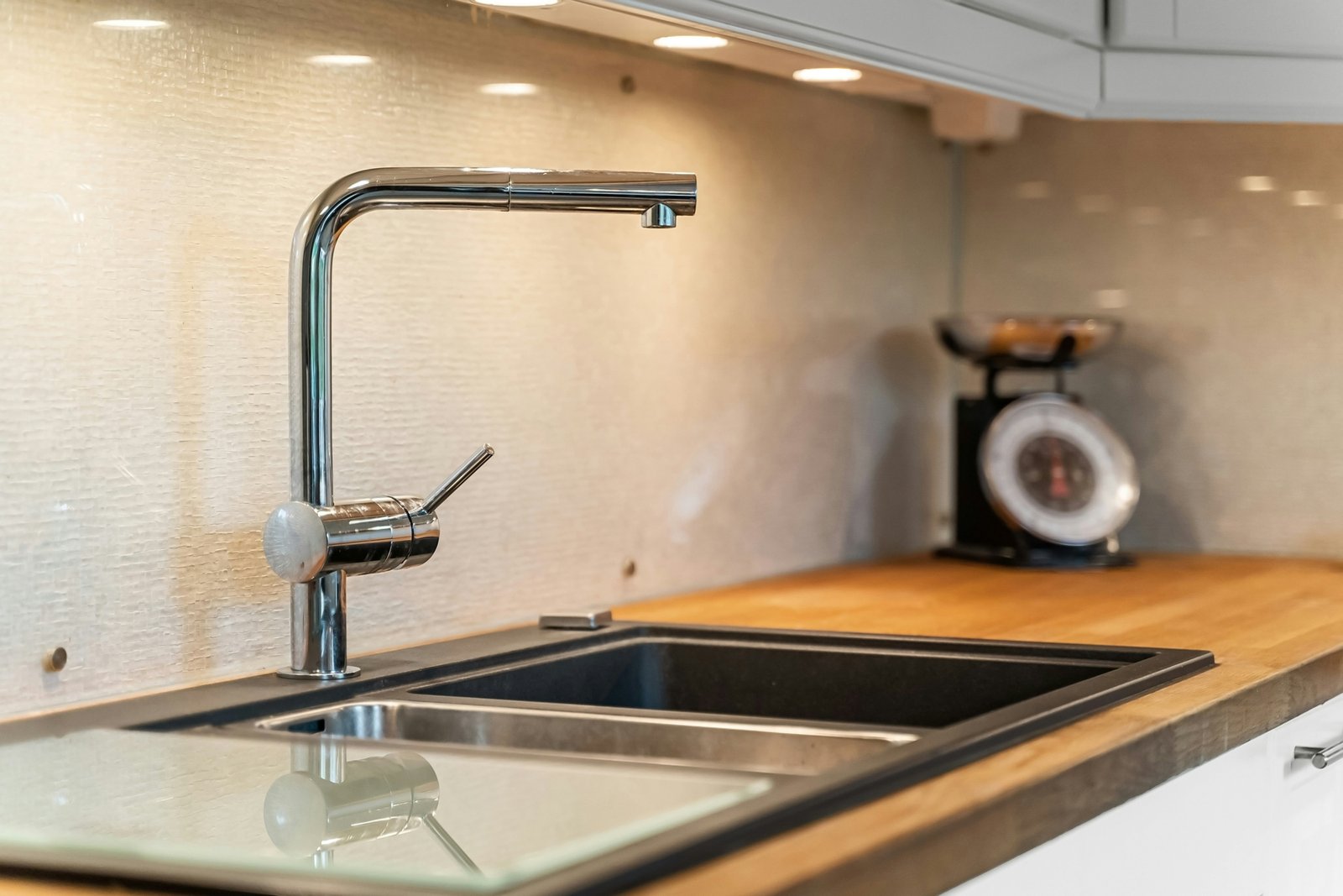 Hebel einer Küchenarmatur aus Metall